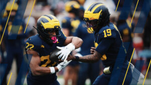 Michigan-quarterback-Bryce-Underwood-19-hands-off-to-running-back-Justice-Haynes-scaled.jpg